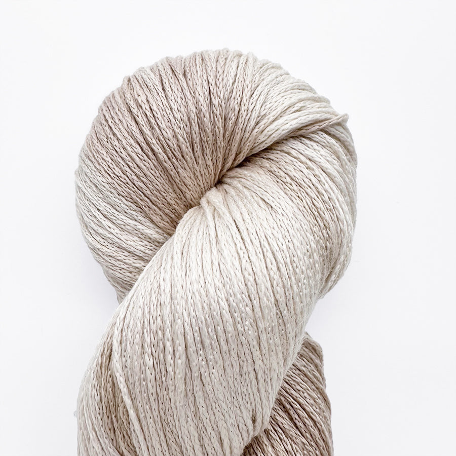 Berroco Tillie yarn in soft cotton and cupro blend, shown in a range of pastel and neutral shades, ideal for lightweight summer knits.